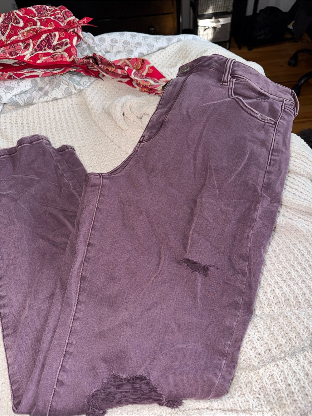 American Eagle Outfitters next level stretch jeggings in distressed maroon.